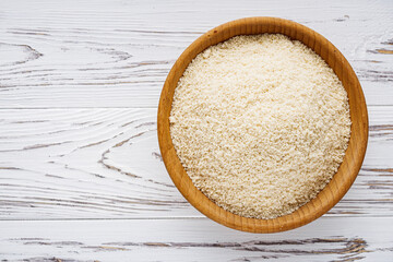 almond flour on a white wooden rustic background