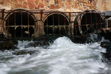 Water flows from the pipe into the sea, environmental pollution. Sewerage, treatment facilities