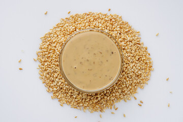 sesame tahini paste on a white acrylic background