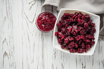 dried cranberry berry on a white wooden rustic background