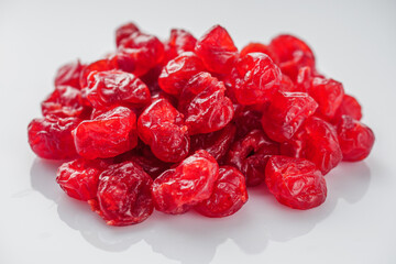 dried cherry berry on a white acrylic background