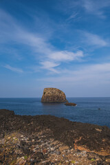 Rock in the ocean near Porto da Cruz on the north coast of Madeira , Portugal. October 2021