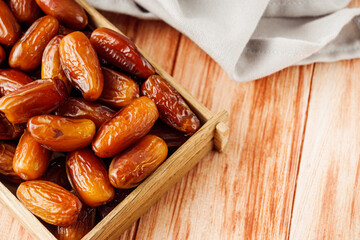 juicy royal dates on a wooden rustic background