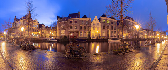 Panorama of the city embankment in Leiden at sunrise.