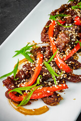 Sichuan roasted beef on a black background