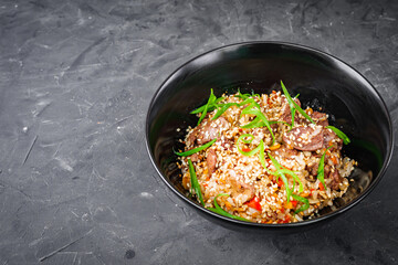 traditional chinese fried rice on black background