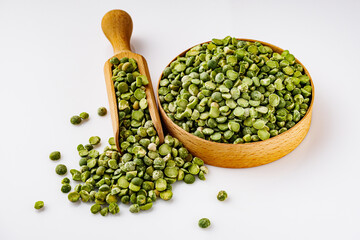 dried green peas on a white acrylic background