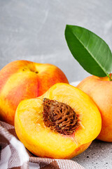 juicy fresh natural peaches on a gray stone background