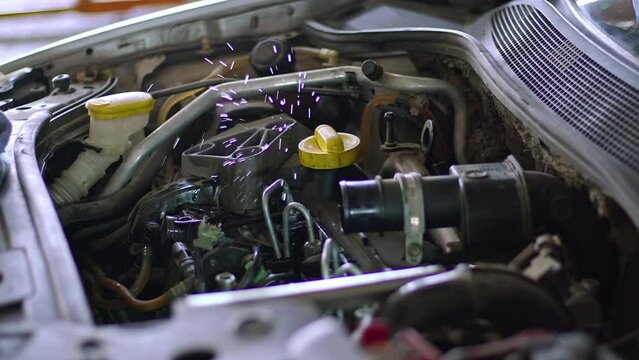 Pipe Leakage Testing of Defective Vehicle Engine Fuel System in Auto Repair Shop Footage.