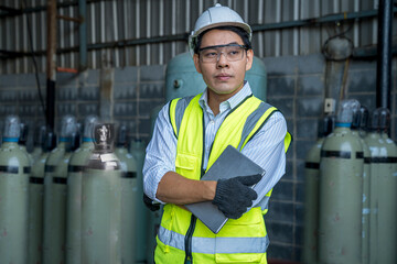 Foreman or Professional technician holding tablet in an industrial factory. Industrial worker...