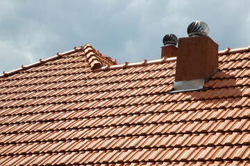 Naklejka premium new red tiles roof and blue sky