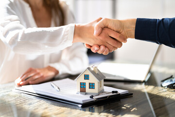 Real Estate House Investment. Handshake With Realtor