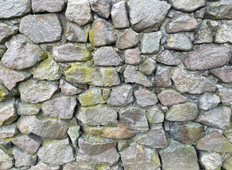 Background of big old stones in the wall. Texture of old stones in the wall