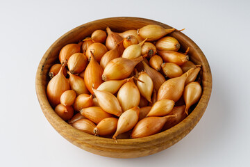 onion seeds on a white rustic background