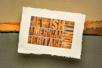 Jewish American Heritage Month - word abstract in vintage letterpress wood type on a handmade paper against abstract landscape, Jew legacy and tradition concept