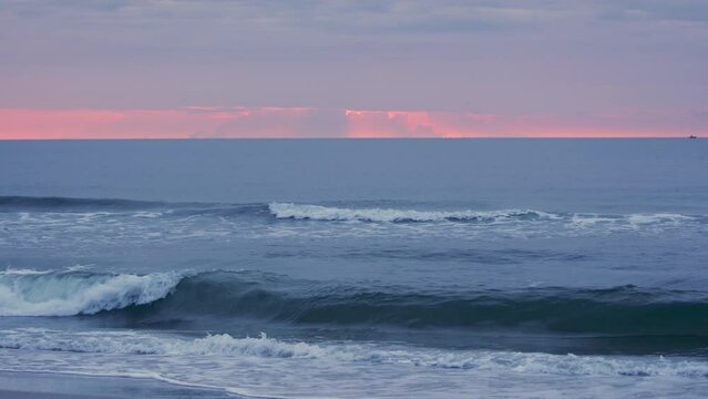 Pink ocean waves sunrise on the beaches of Florida