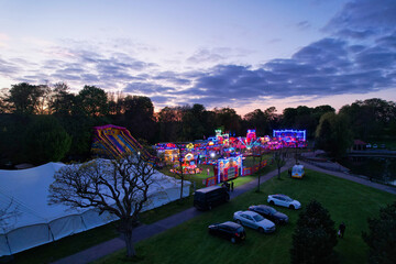 Aerial view of Fun fair at Wardown Park Luton town of England UK, drone footage