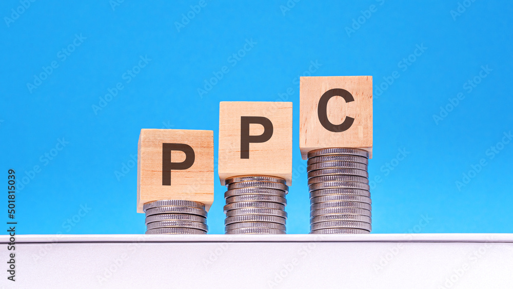 Poster ppc - text on wood cube block stack with coins