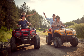 Group of traveler friends driving quads