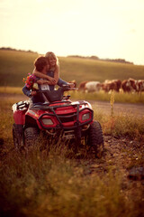 couple in love on the mountain.Wedding in nature. man and woman enjoying a quad atv vehicle