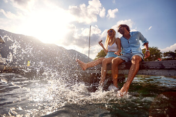 happy man and woman enjoying together at holiday - 501816646