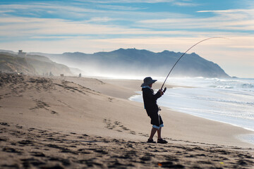 A Man Shore Fishing on the Beach in Northern California
