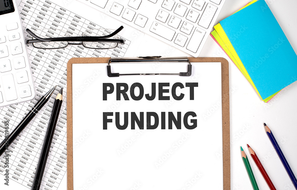 Poster clipboard with text project funding and keyboard and chart on the white background.