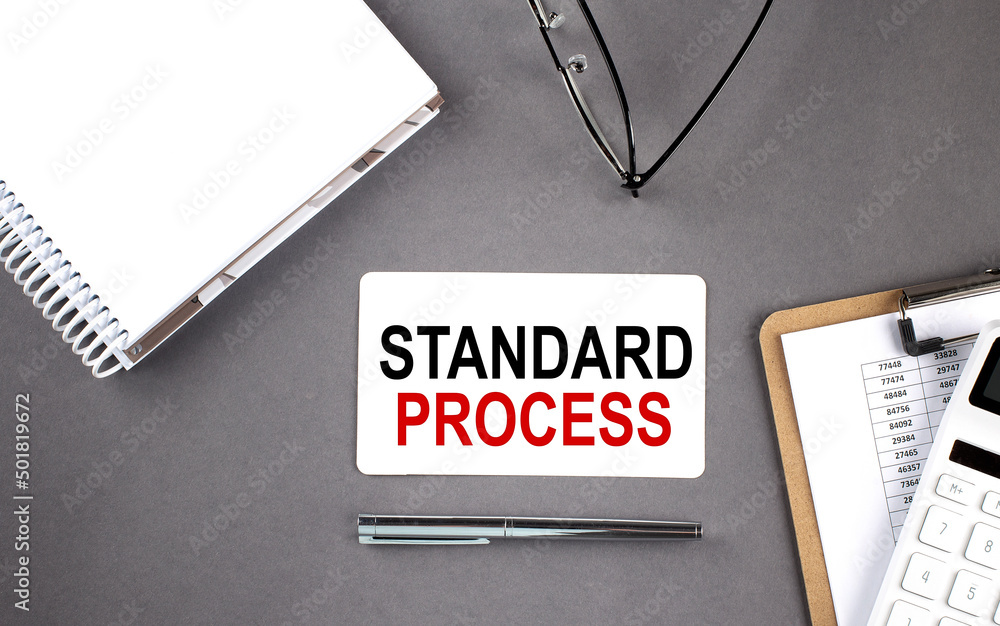 Poster standard process text written on the card with notebook and clipboard, grey background