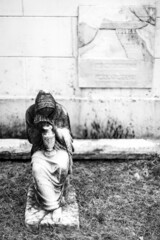 Statue of a Woman Grieving in a New Orleans Graveyard