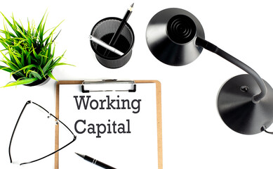 WORKING CAPITAL text on a clipboard on the white background