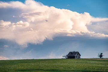 Storm Approaching an Abandoned House on the American Western Plains