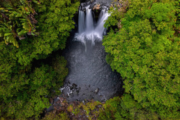 Aerial Long Exposure view of Leon waterfall (Cascade Leon) which is hidden in a forest located in the south of Mauritius island