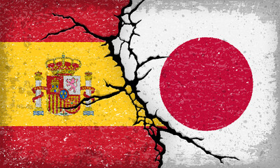 スペインと日本国旗が割れたコンクリートにペイントされた背景