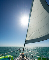 Sunburst Behind Unfiurled Sail