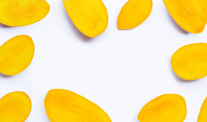 Tropical fruit, Frame made of mango slices on white background.