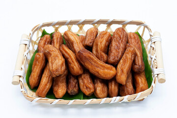 Sun-dried bananas on white background.