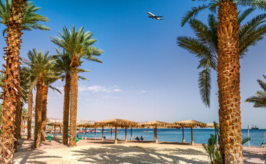 Morning with tourist rest area on public beach of the Red Sea, Middle East. Concept of happy and...