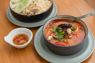 Thai hot spicy soup with pork and seafood as traditional Thai food for meal