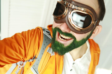 A man with a green beard. St.Patrick 's Day. Irish fan color beard.