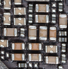 Details and microcircuits on the board as a background.