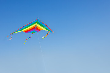 kite flying in the clear blue sky