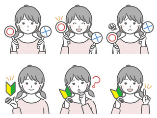 〇✕マークや初心者マークを持つ女の子