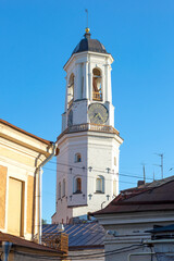 Ancient clock tower above the roofs of the old city. Vyborg, Russia