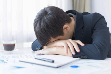 Business partners concept a male young entrepreneur tired of working on a big project and facing a big trouble