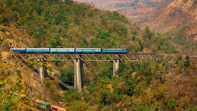 Indian railway passing a classic bridge
