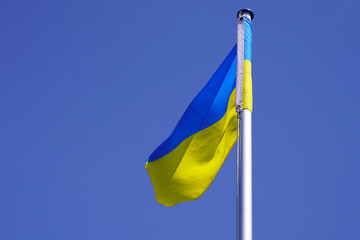 flag ukrainian National country state flag of Ukraine banner on white matin liberty  blue sky