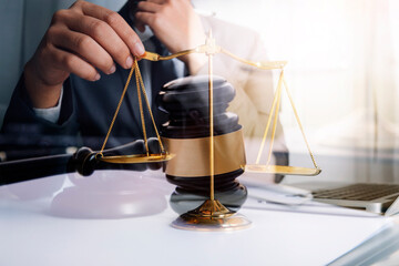 Judge gavel and legal book on wooden table, justice and law concept