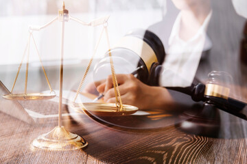 Judge gavel and legal book on wooden table, justice and law concept