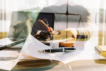 Judge gavel and legal book on wooden table, justice and law concept