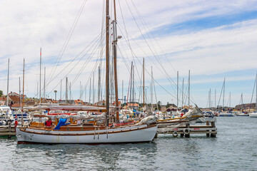 Fototapeta premium Sailboat in a harbor by the sea